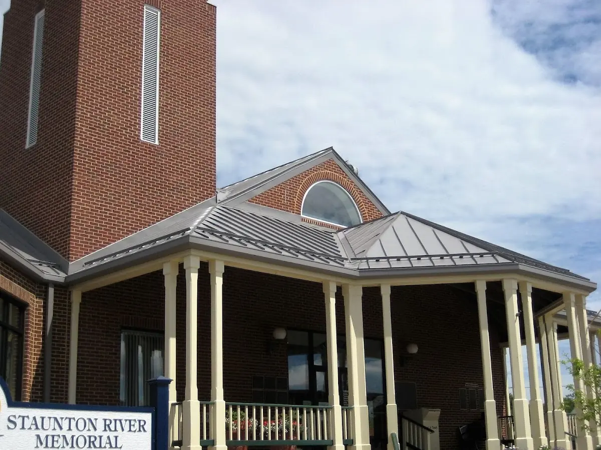 Skilled roofing craftsmen working on a residential roof in Carlinville